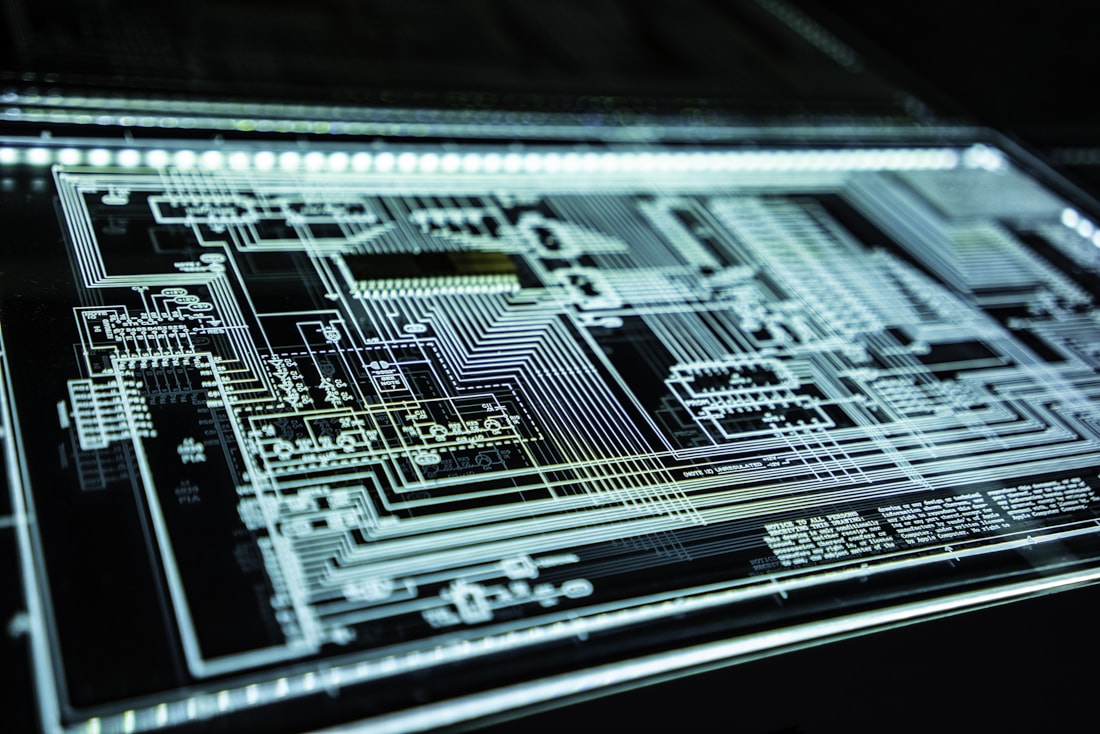 Developer workstation with code and system monitoring screens